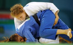 Algeria Lila Latrous (bottom) and Finland Nina Koivumaki compete