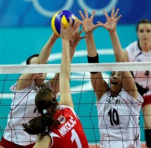 Algeria's Lydia Oulmou, left, and teammate Fatima Zahra Oukazi