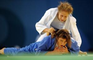 Algeria Lila Latrous (bottom) and Finland Nina Koivumaki compete