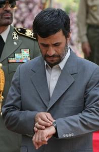 Iranian President Mahmoud Ahmadinejad waits for the arrival of