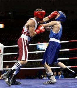 Abdelhalim Ourradi (L) of Algeria fights John Joseph Nevin