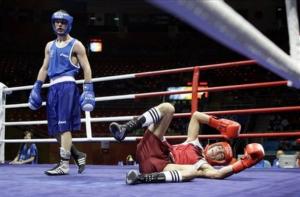 Abdelhalim Ourradi, right, of Algeria lies on the as