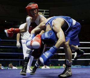 Abdelhalim Ourradi, red, of Algeria and John Joseph Nevin,