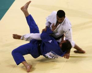 Irakli Tsirekidze of Georgia (blue) fights with Amar Benikhlef