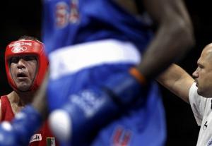 Referee Peter Dorko does a standing count for Abdelaziz