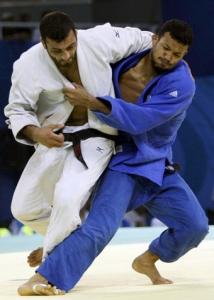 Yves-Matthieu Dafreville of France (blue)  fights with Amar