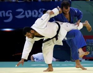 Irakli Tsirekidze of Georgia (blue) fights with Amar Benikhlef