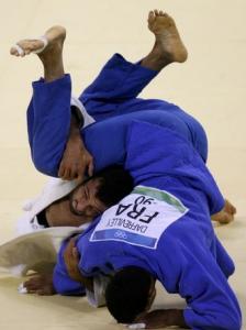 Yves-Matthieu Dafreville of France (blue) fights with Amar Benikhlef