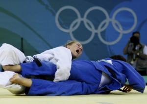 Ronda Rousey of the U.S. (white) fights with Rachida