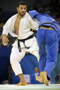 Morocco's Mohamed El Assri (R) and Algeria's Amar Benikhlef