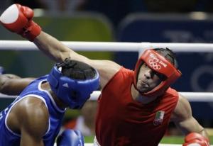 Newfel Ouatah. right, of Algeria, fights Jose Payares of