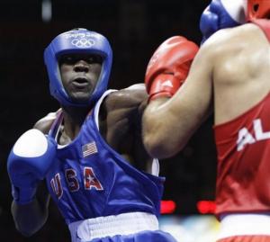 USA's Deontay Wilder fights Abdelaziz Touilbini of Algeria during