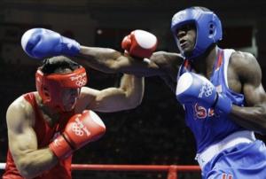 Abdelaziz Touilbini of Algeria, left, fights USA's Deontay Wilder
