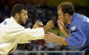 Georgia's Irakli Tsirekidze (R) and Algeria's Amar Benikhlef compete