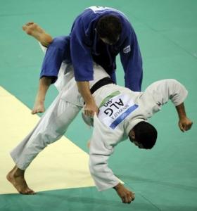 Georgia's Irakli Tsirekidze (top) and Algeria's Amar Benikhlef compete