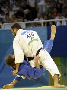 Georgia's Irakli Tsirekidze (bottom) and Algeria's Amar Benikhlef compete
