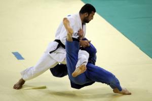Georgia's Irakli Tsirekidze (bottom) and Algeria's Amar Benikhlef compete