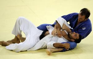 Georgia's Irakli Tsirekidze (R) and Algeria's Amar Benikhlef compete