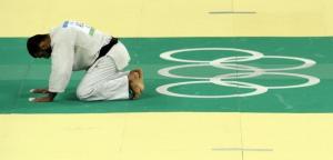 Algeria's Amar Benikhlef looks dejected after being defeated by