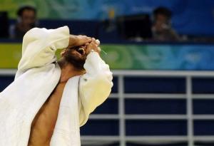 Algeria's Amar Benikhlef reacts after winning his fight against