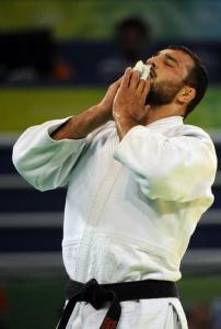 Algeria's Amar Benikhlef reacts after winning his fight against