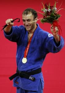 Georgia's Irakli Tsirekidze celebrates on the podium with his