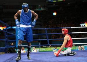 Algeria's Newfel Ouatah (R) tumbles to the canvas against