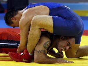 Samir Bouguerra of Algeria (in red) fights Jiang Huachen