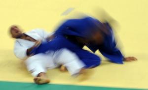 Algeria's Hassane Azzoun (L) and Azerbaijan's Movlud Miraliyev compete