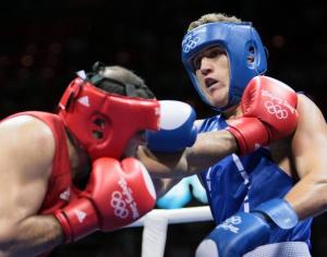 Algeria's Abdelhafid Benchabla (R) fights against Egypt's Ramadan Yasserduring