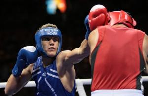 Algeria's Abdelhafid Benchabla (L) fights against Egypt's Ramadan Yasserduring
