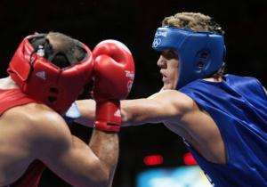 Algeria's Abdelhafid Benchabla (R) fights against Egypt's Ramadan Yasserduring