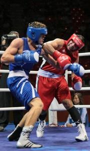 Algeria's Abdelhafid Benchabla (L) fights against Egypt's Ramadan Yasserduring
