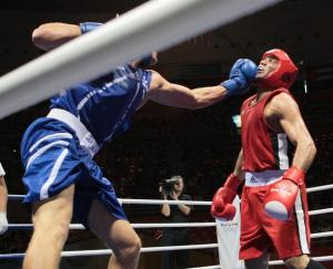 Algeria's Abdelhafid Benchabla (L) fights against Egypt's Ramadan Yasserduring