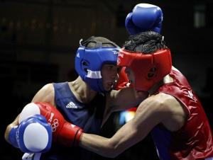 Sailom Adi (R) of Thailand fights Abdelkader Chadi of