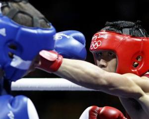 Sailom Adi (R) of Thailand fights Abdelkader Chadi of