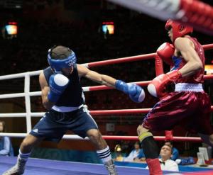 Algeria's Abdelkader Chadi (L) fights against Thailand's Sailom Adi