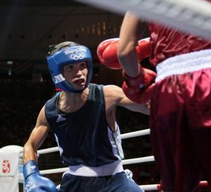 Algeria's Abdelkader Chadi (L) fights against Thailand's Sailom Adi