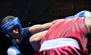 Algeria's Abdelkader Chadi (L) fights against Thailand's Sailom Adi
