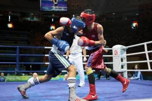 Algeria's Abdelkader Chadi (L) fights against Thailand's Sailom Adi