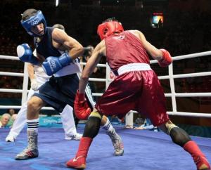 Algeria's Abdelkader Chadi (L) fights against Thailand's Sailom Adi