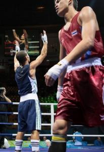 Algeria's Abdelkader Chadi (L) is declared winner after defeating
