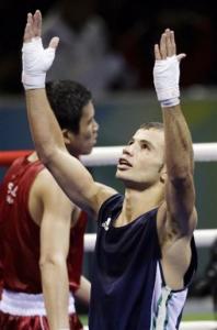 Abdelkader Chadi, right, of Algeria, gestures after beating Adi