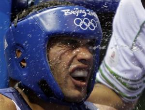 Nabil Kassel of Algeria has water splashed on his