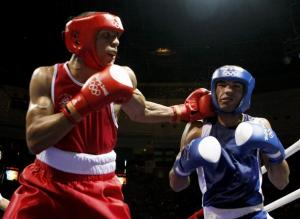 Darren John Sutherland (L) of Ireland punches Nabil Kassel