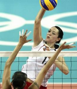 Lydia Oulmou, of Algeria, spikes against Olga Nassedkina, of