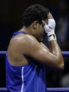 Mohammed Arjaoui of Algeria reacts after being defeated by