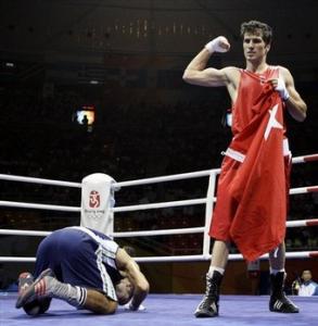 Yakup Kilic of Turkey, right, reacts after he defeats