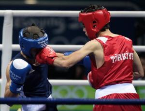Turkey's Yakup Kilic (R) fights against Algeria's Abdelkader Chadi