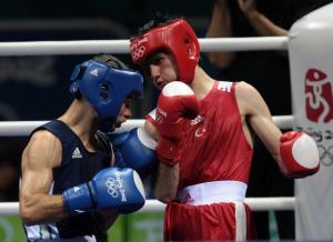 Turkey's Yakup Kilic (R) fights against Algeria's Abdelkader Chadi